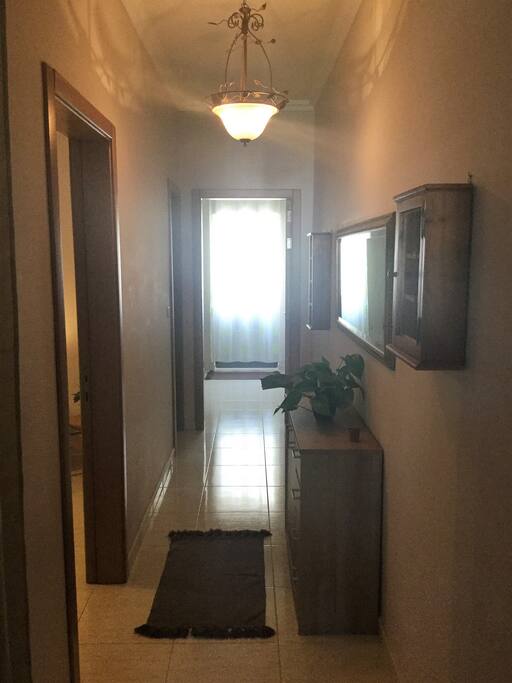 Hallway leading from living space into bedrooms.