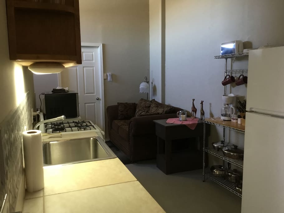 Kitchen looking into the TV area