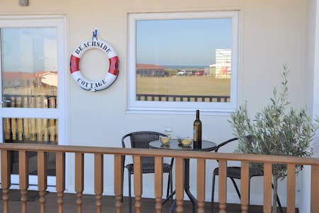 Beachside Cottage with sea views and dog friendly.