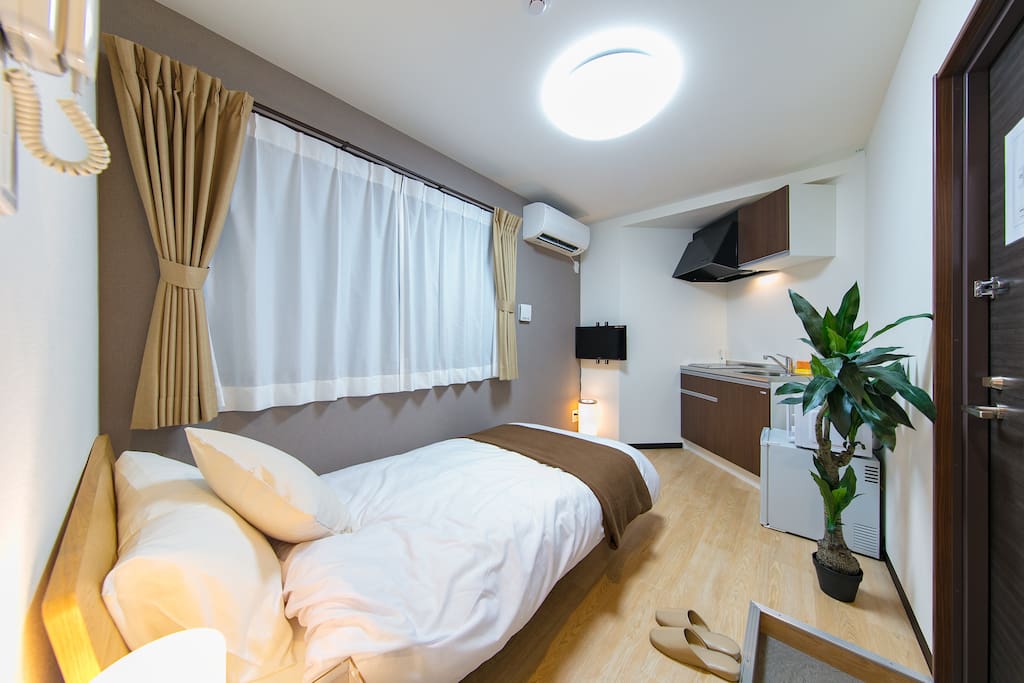 A stunning room with a bed and a kitchen. Bright in daytime and have a warm, harmonious atmosphere in nights. Best place to stay and get out of tiredness!