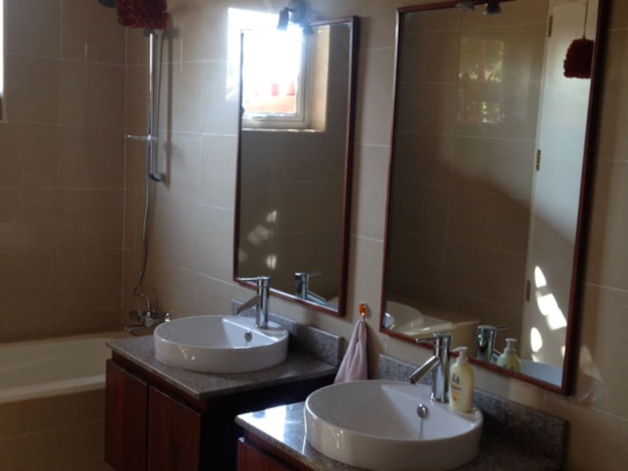 Luxury bathroom with shower and bathtub.