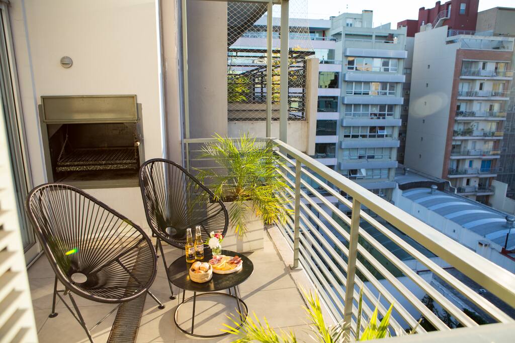 Balcony with a classic Argentinian "parrilla" barbacue.