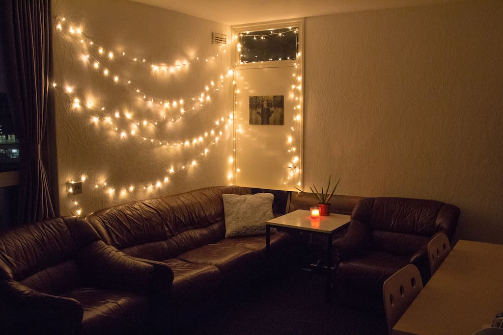 Fairy lights in bedroom 1, for that sense of cosiness. The big sofa is the one the third person can sleep on (we have an extra duvet).