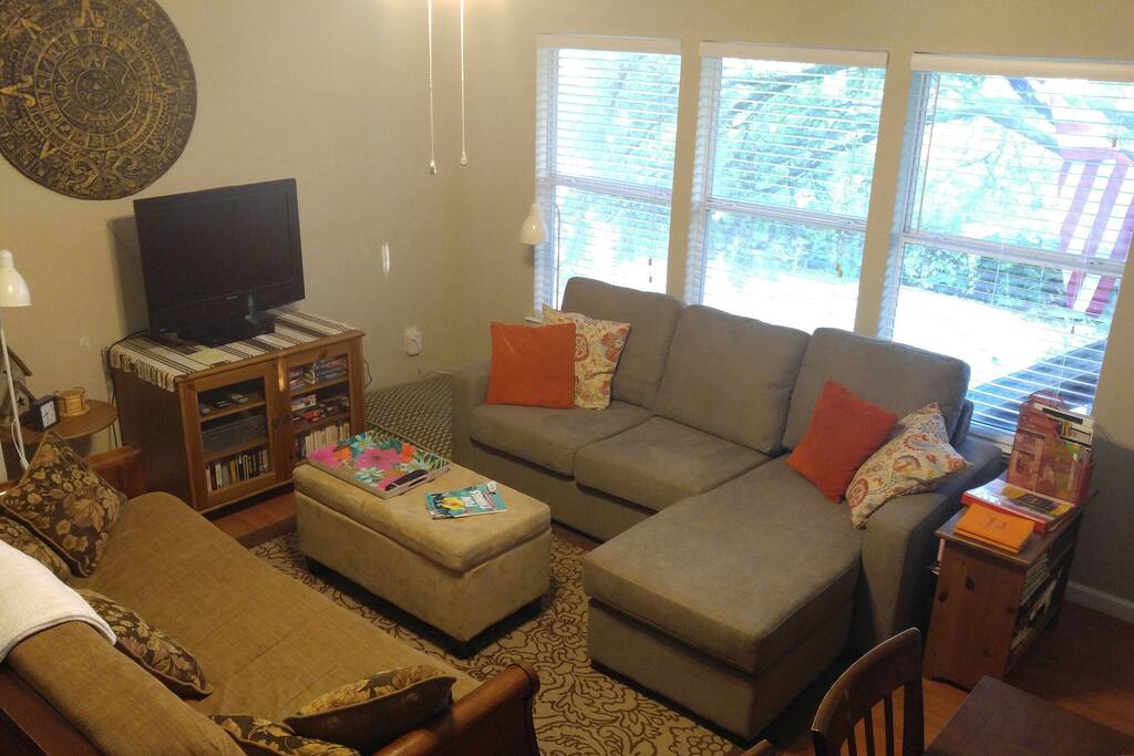 Living room with view of pool and yard (New couch - summer 2017!)