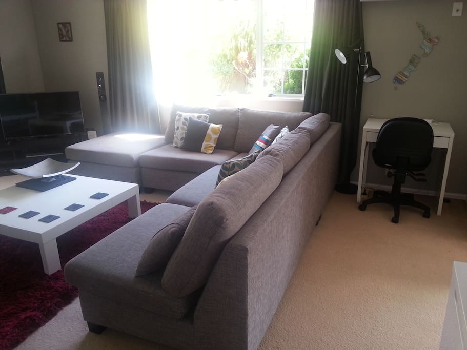 Large lounge with Sky TV, blue-ray player with surround sound, small desk space.