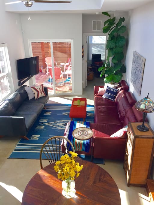 Cozy living space connected to kitchen. Door pictured leads to office, can be converted to second bedroom with air mattress. Upon request*