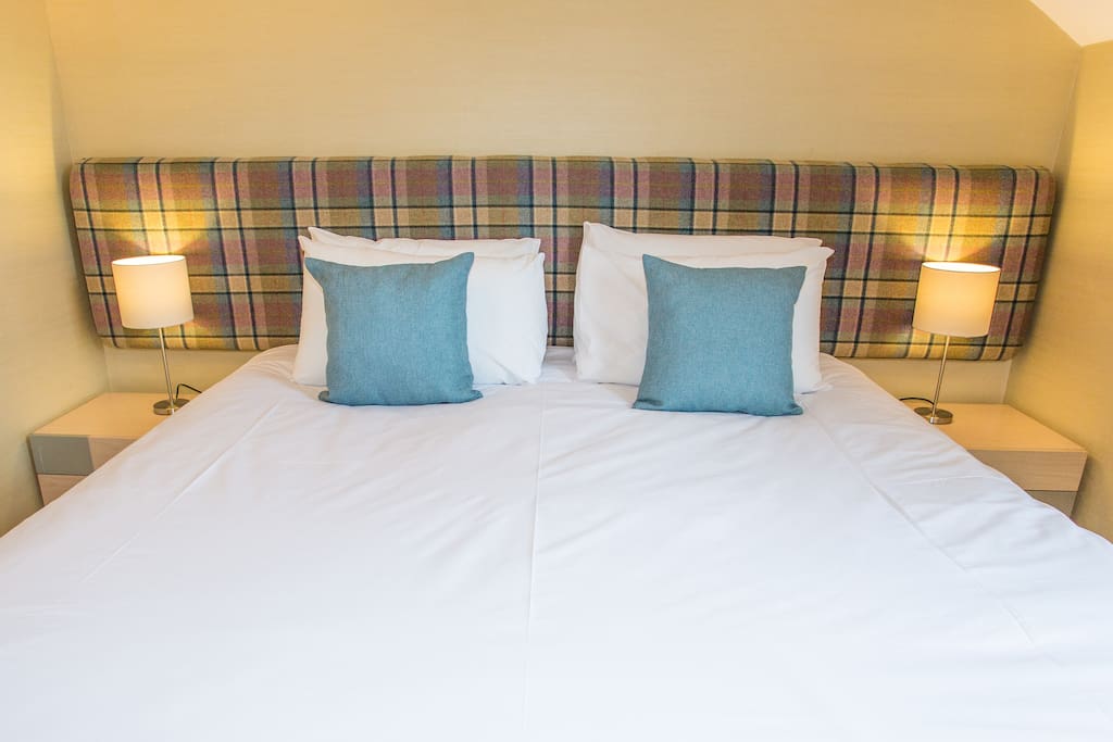 Bespoke headboards and complimentary soft furnishings give each room at Butt Lodge its own unique character
