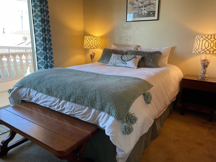 Queen bedroom with balcony.