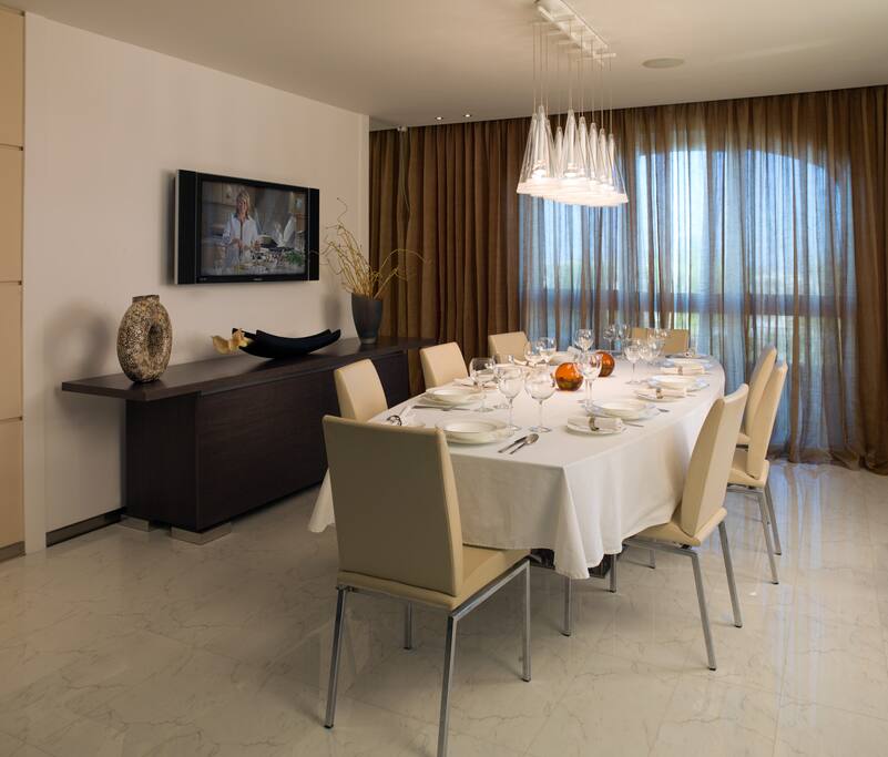 The villa includes a number of different options for dining. This is the formal one for 8 people.
