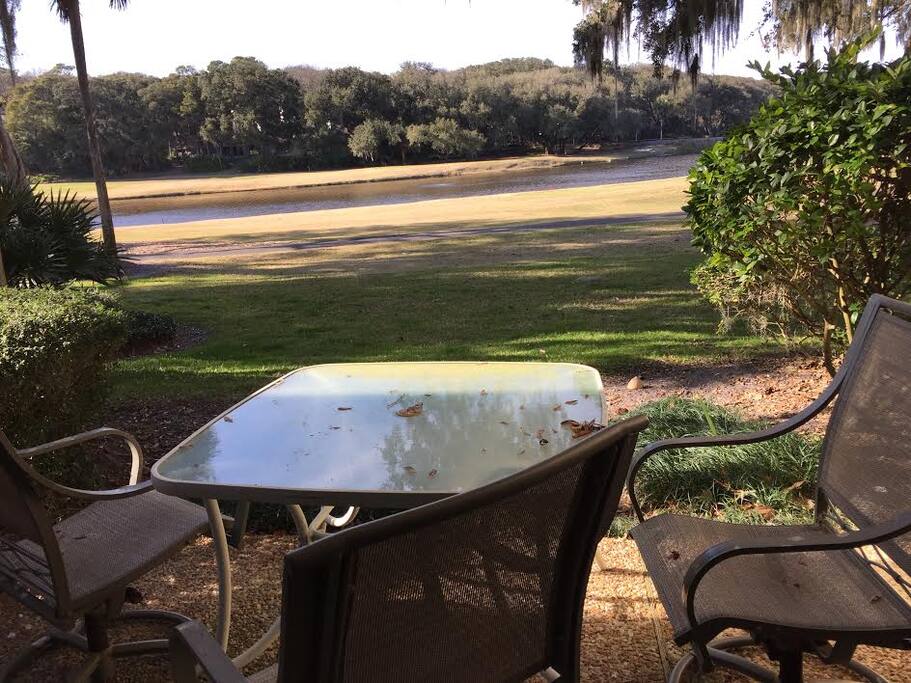 Backyard view of the golf course and lake.