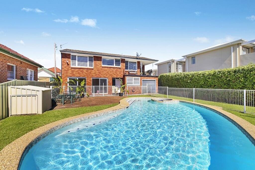 Manicured lawns surrounding the pool