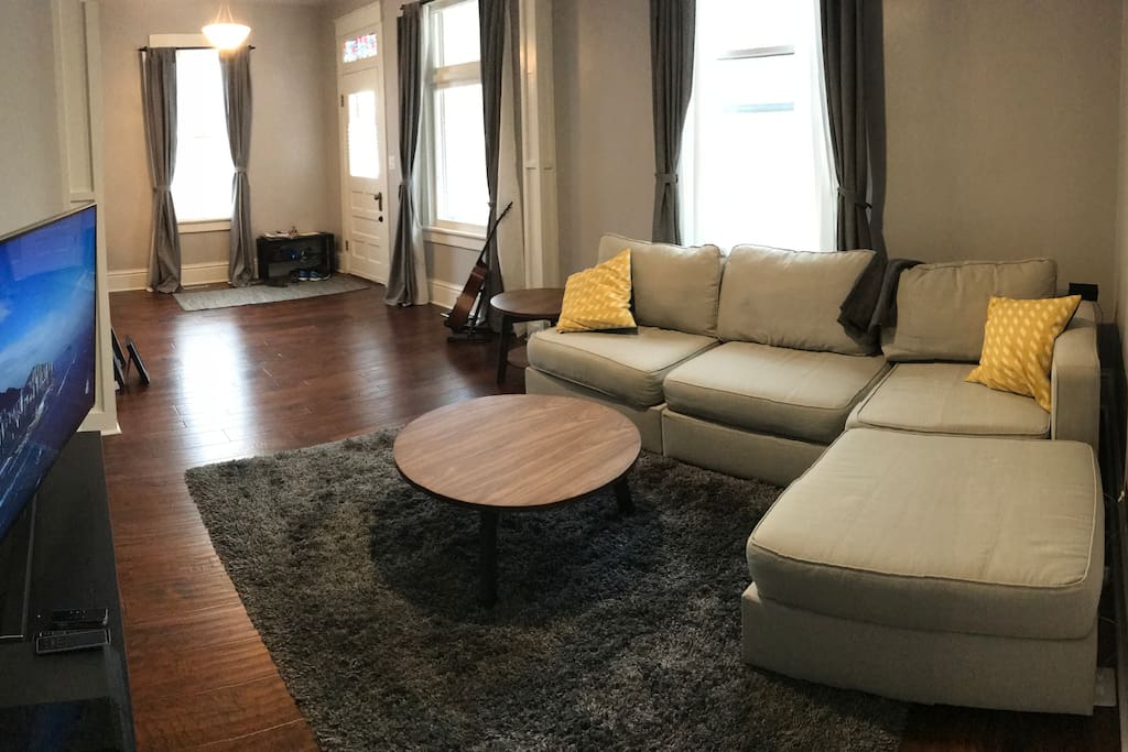 Living room, with tv and several streaming services.