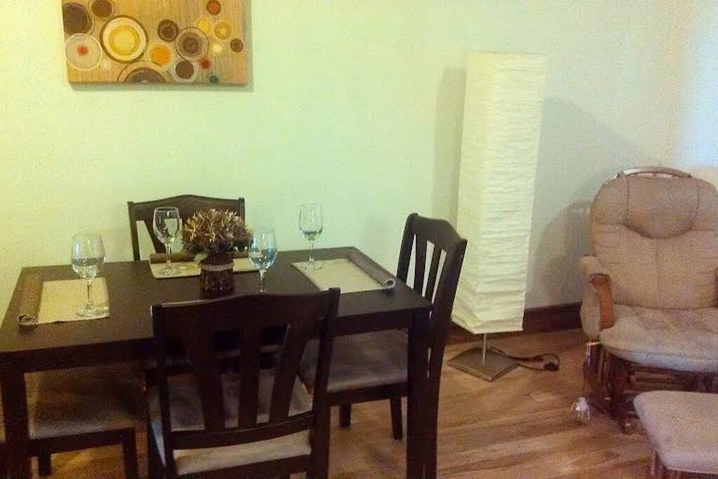 Dining room that seats 4 and rocking chair perfect for reading.