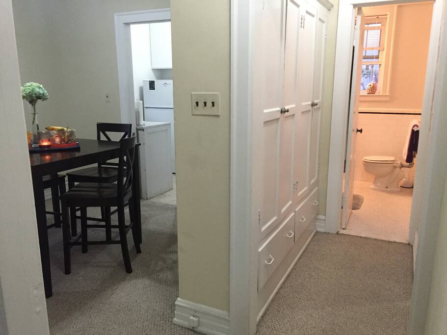 Entry from living room to the kitchen, dining room, bathroom, and bedroom