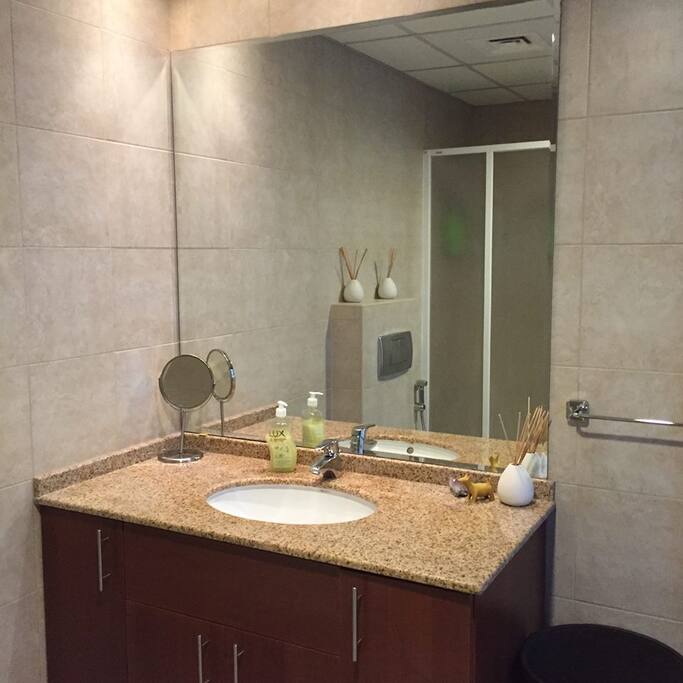 Large bathroom with both shower and bath