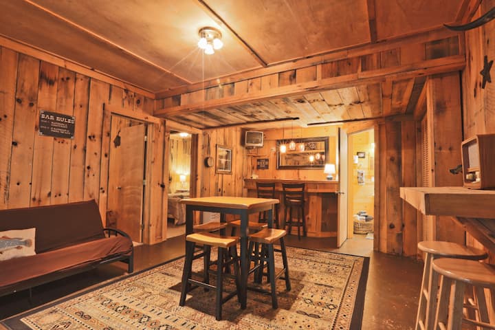 Family room with seating, mini bar, and TV