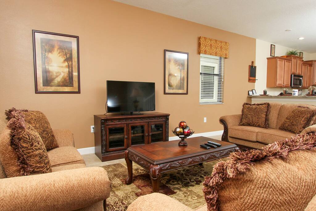 Flat screen TV with multiple sofas