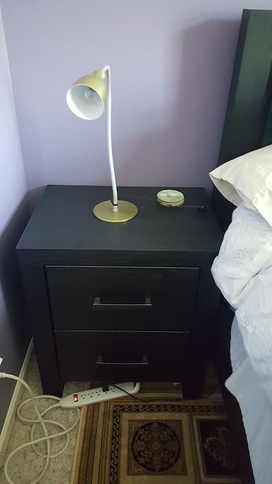 Night stand offers drawer space and a place to put a cup of coffee or glass of wine.