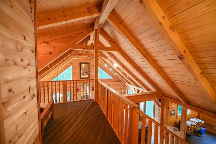 Loft bunks at top of steps in front of King master bedroom