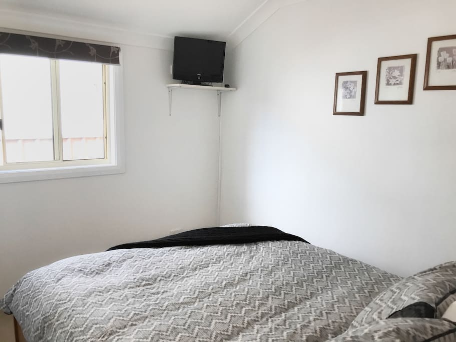 Bedroom; small TV, natural light & fresh air.
