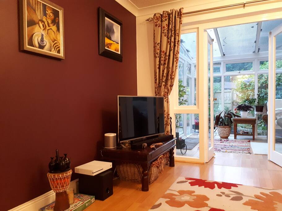 Living room leading to conservatory (sun room)