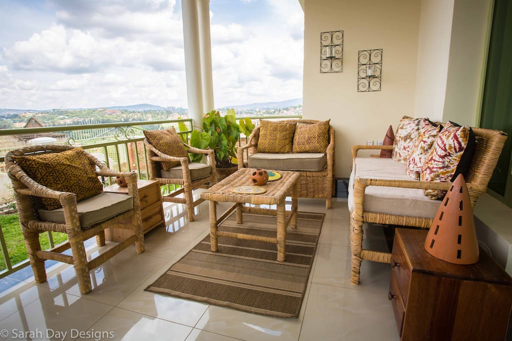 Front porch has a cozy sitting space and a breakfast table!