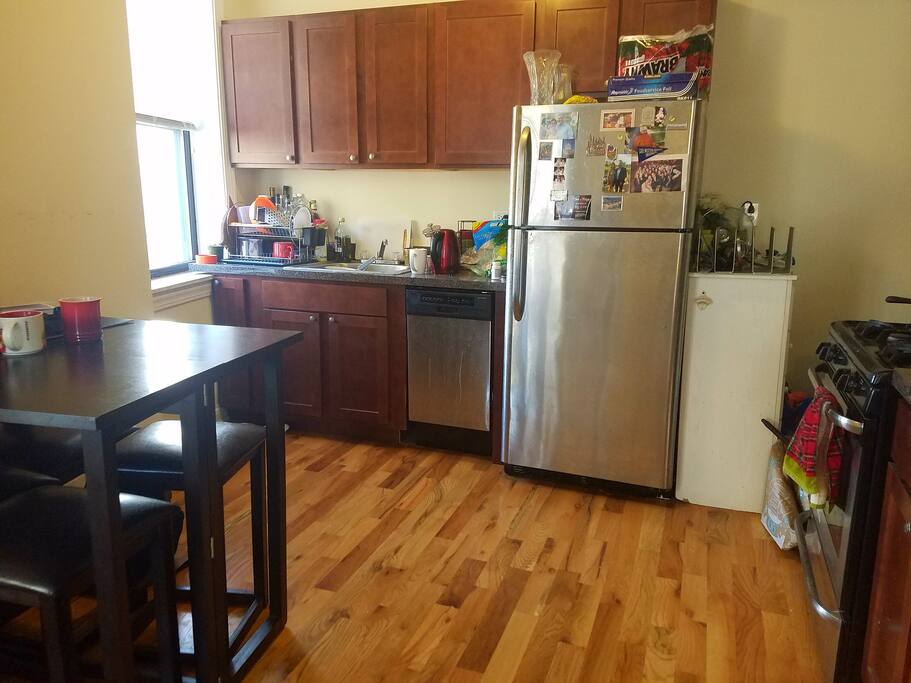 Kitchen with taller bar-style table that fits four