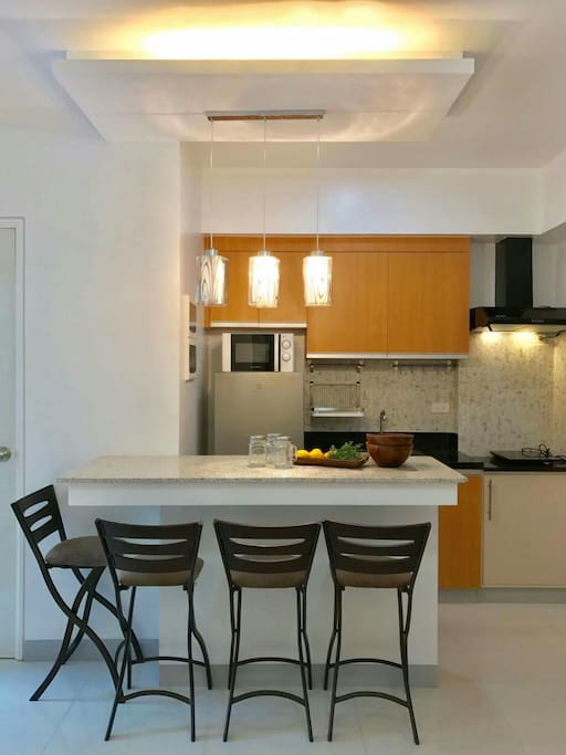 kitchen with breakfast nook dinning area. kitchen complete with ref, microwave, rice cooker, induction cooker. yes, light cooking allowed.