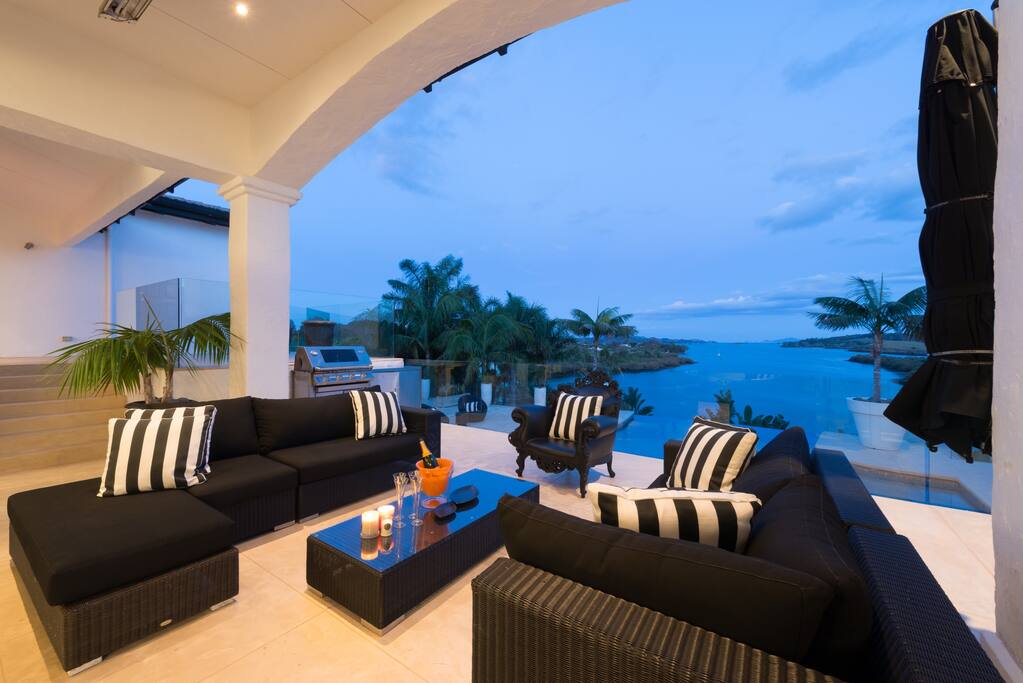 The outdoor living on the upper deck/patio outside the living and dining areas
