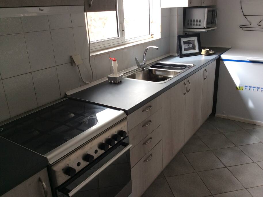 Gas stove, microwave, and refrigerator