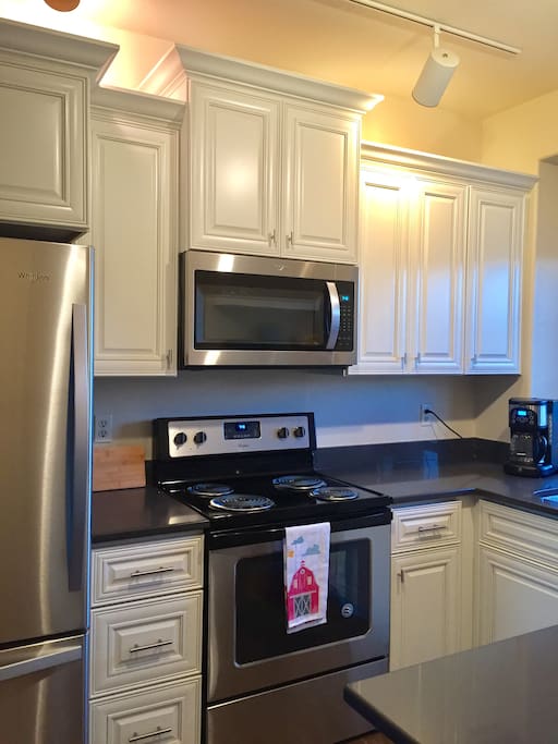 Completely new custom kitchen with quartz countertops and all new Whirlpool appliances.
