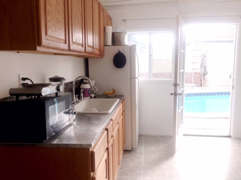 kitchen poolside and the windows and door have drapes to cover light when you sleep. immediately outside the door to your left is a seating section you can have evening dinner and drinks poolside