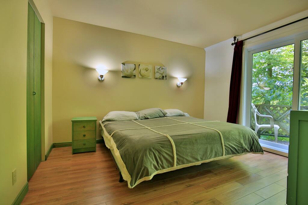 Bedroom 2 with patio door and balcony.