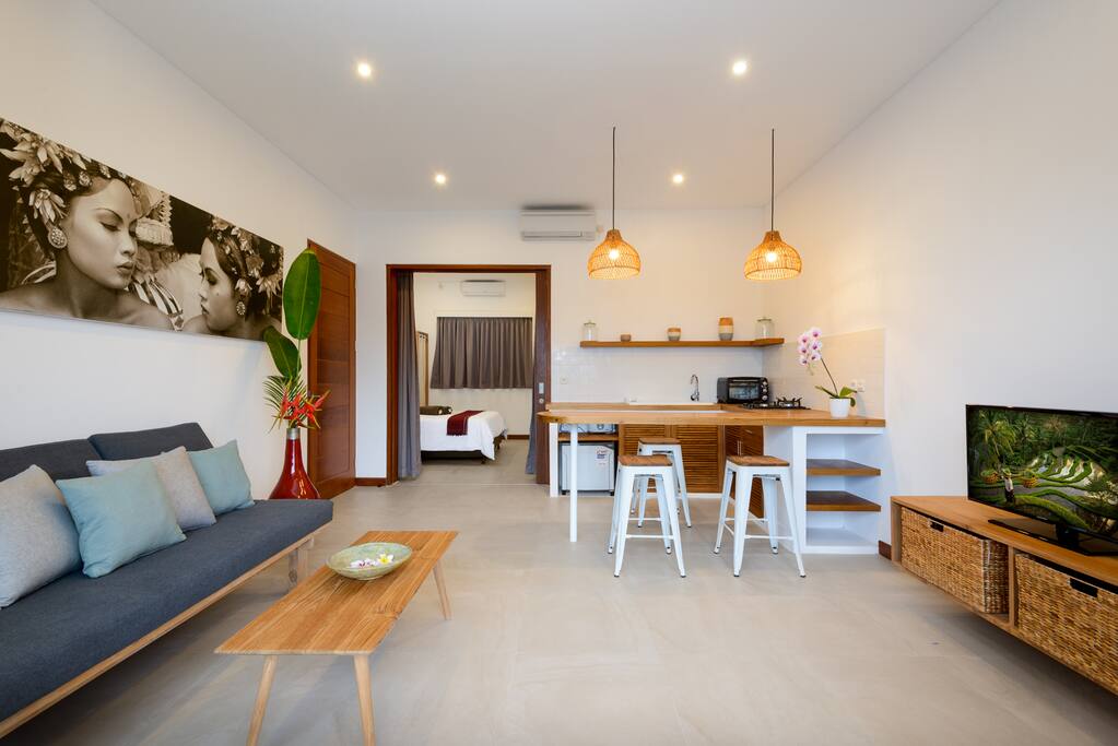 Fully equipped living area with open kitchen