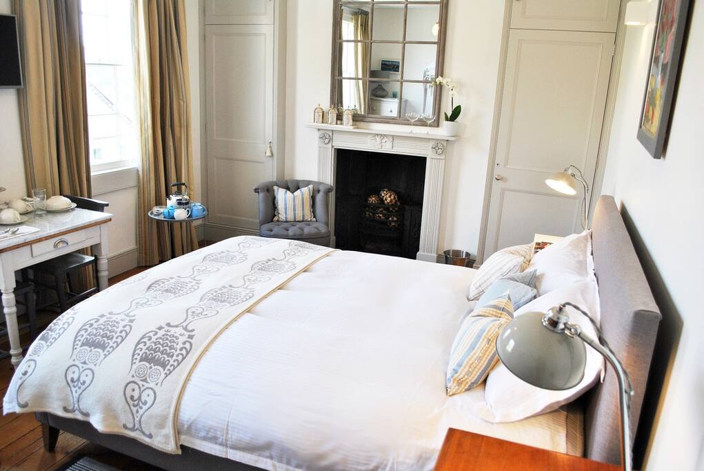 A Little Table and Chairs in the King Bedded Room For Breakfast