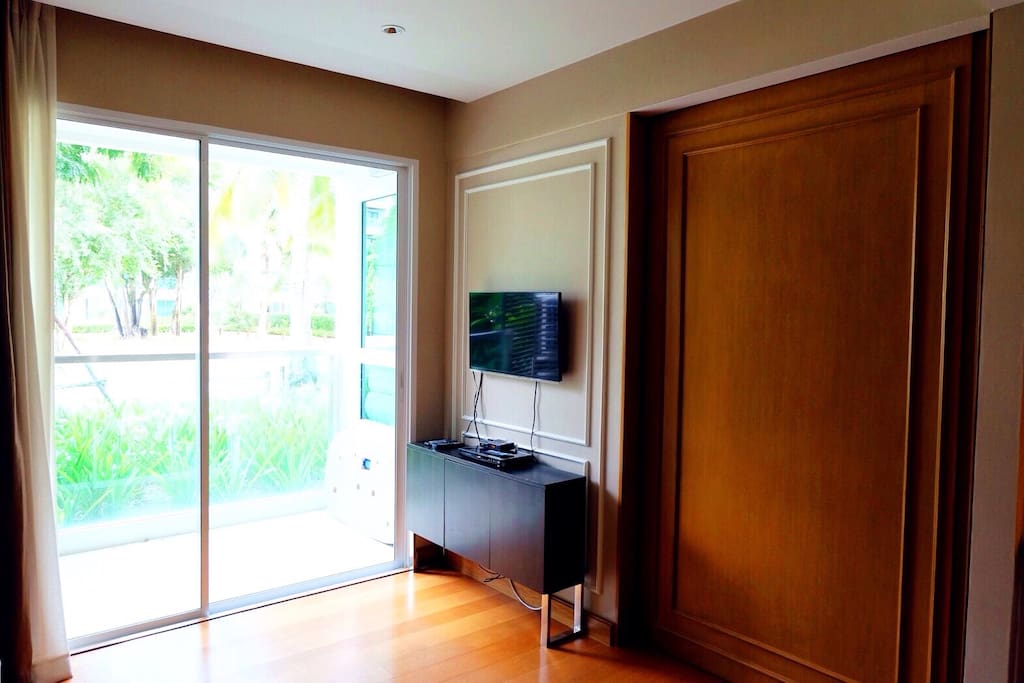 Living room and balcony with garden view