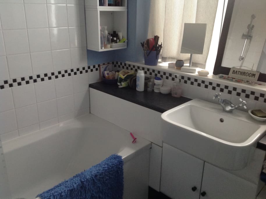 Bathroom with bath or shower.
