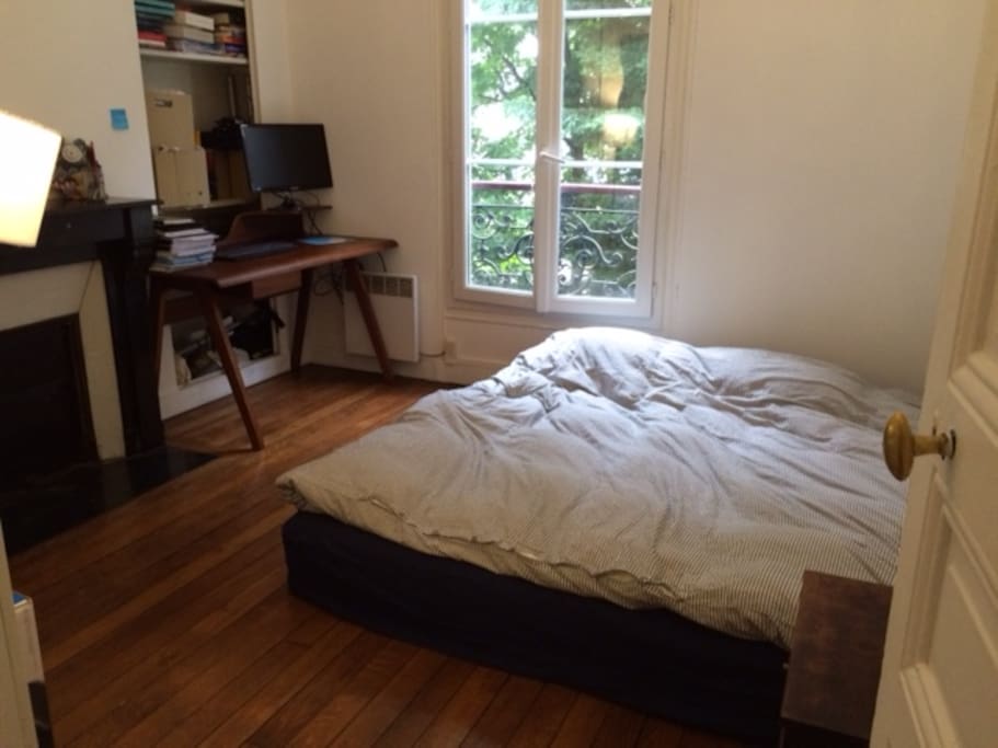 The bedroom faces the garden.
