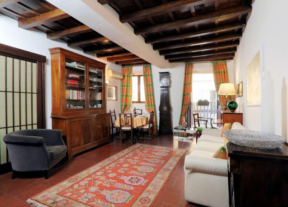 The living room contains a white double sofa-bed, a flat screen TV and is separated from the rest of the house, guaranteeing a good nights sleep.