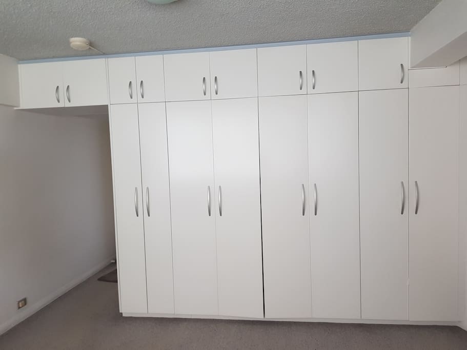 Storage cupboards bed inside, hallway to separate kitchen & bathroom