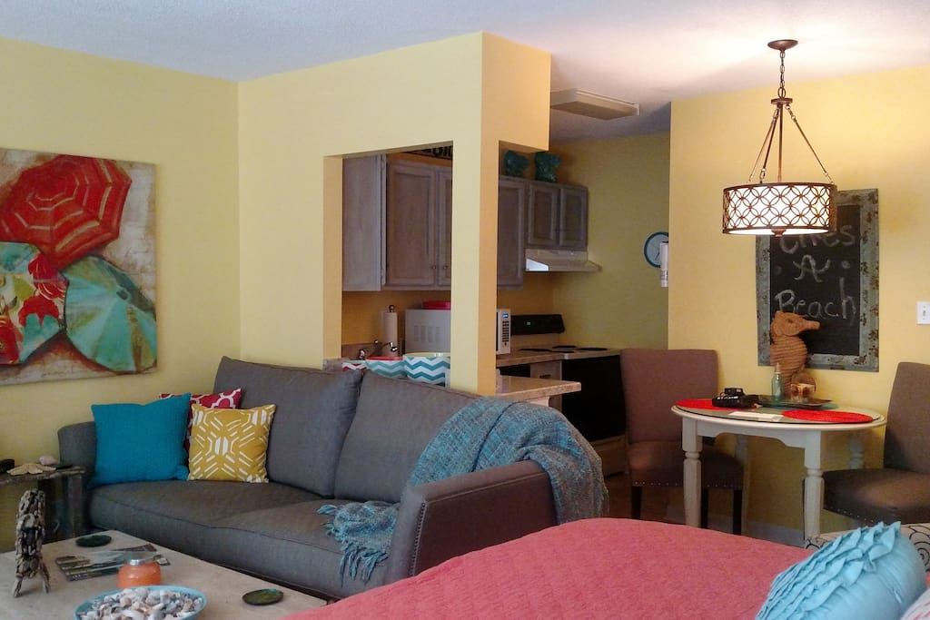 View from the queen bed toward the sofa and kitchen