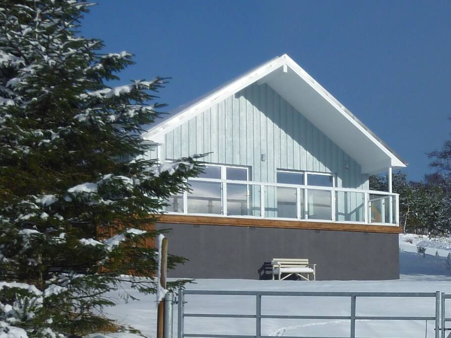 Front view and balcony with seating area