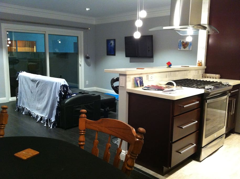 Reverse angle of living area / kitchen / patio