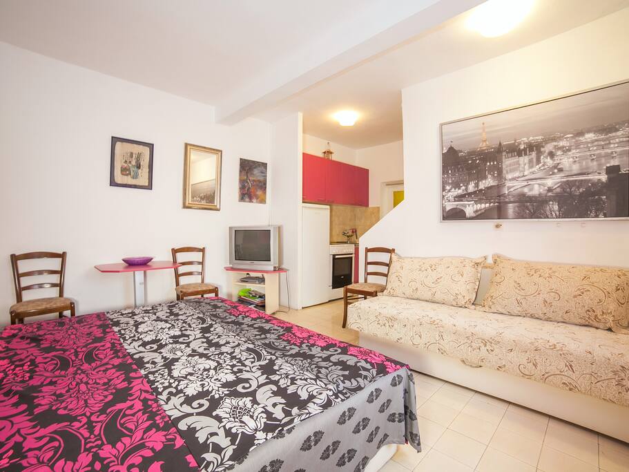 bedroom with a sofa bed and seating area