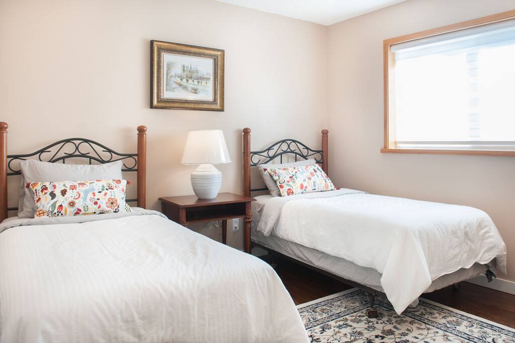 Standard one bedroom suite with two twin beds, garden view