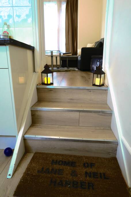 Stairs from kitchen leading up to living room