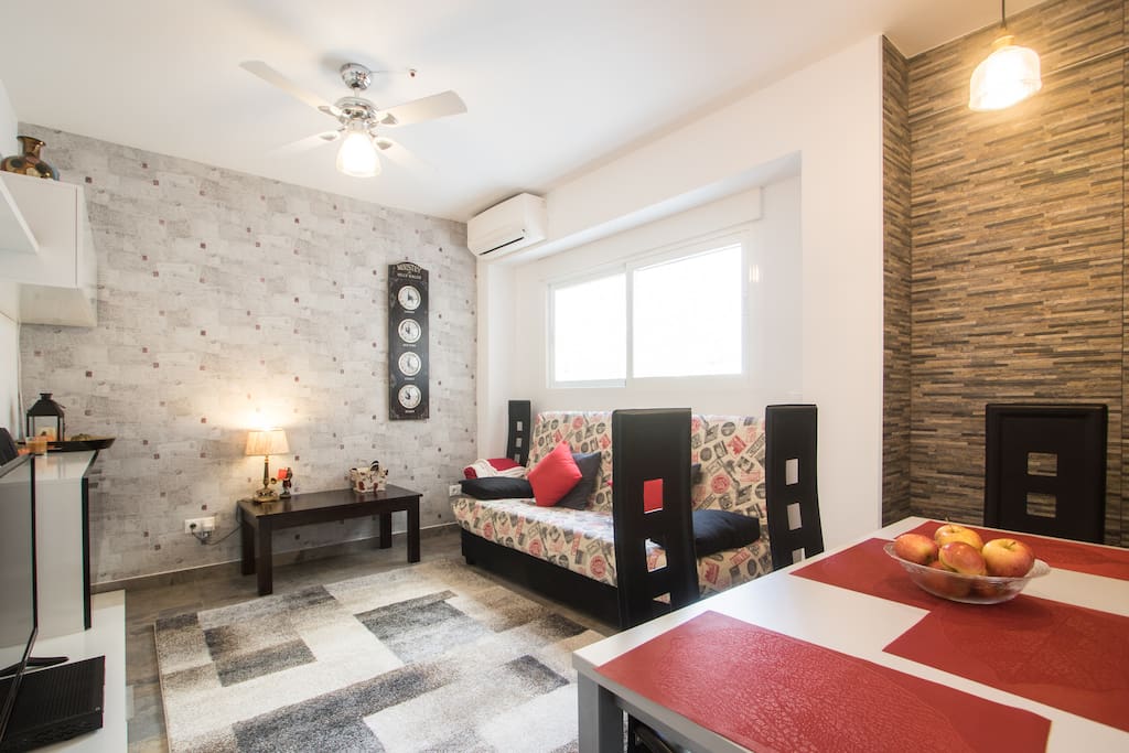 Living room and dining room. Full sized TV, castle views, full size dining table (seats 6) & sofa pulls out into bed (sleeps 2 - 190cm x 135 cm)