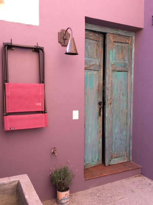 Enter through antique Mesquite Doors