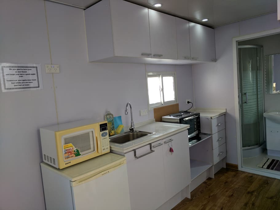Kitchen with Microwave, Fridge, Cooktop