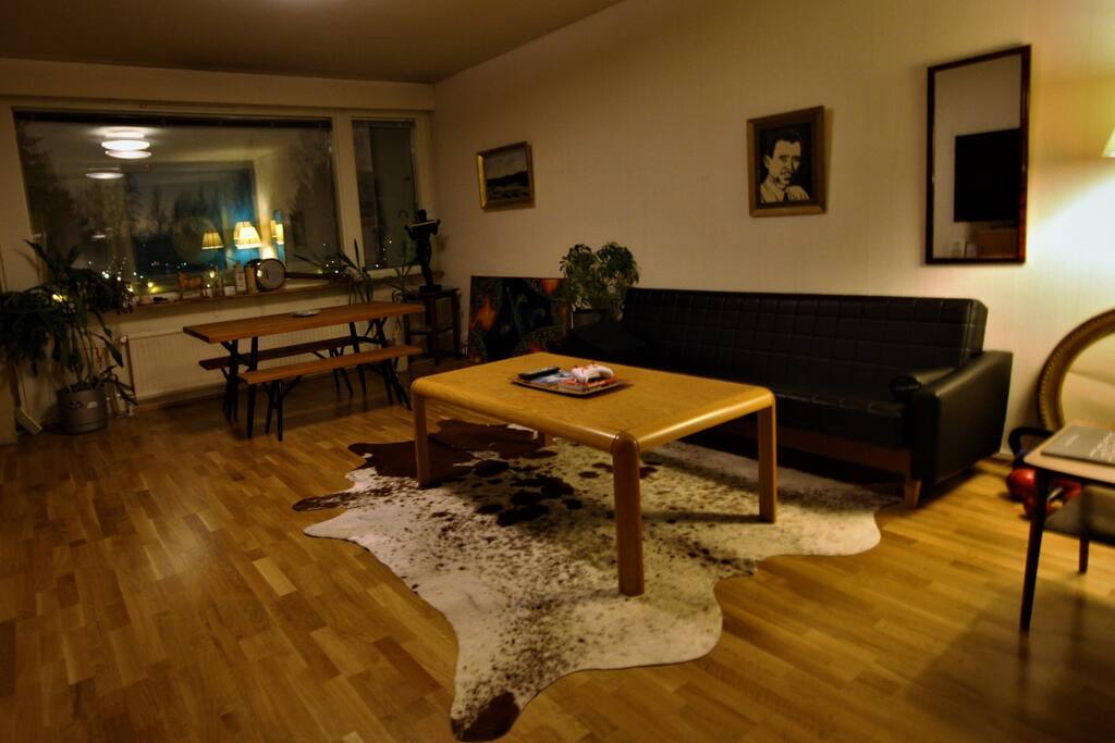 At the end of the living room there is a wide balcony